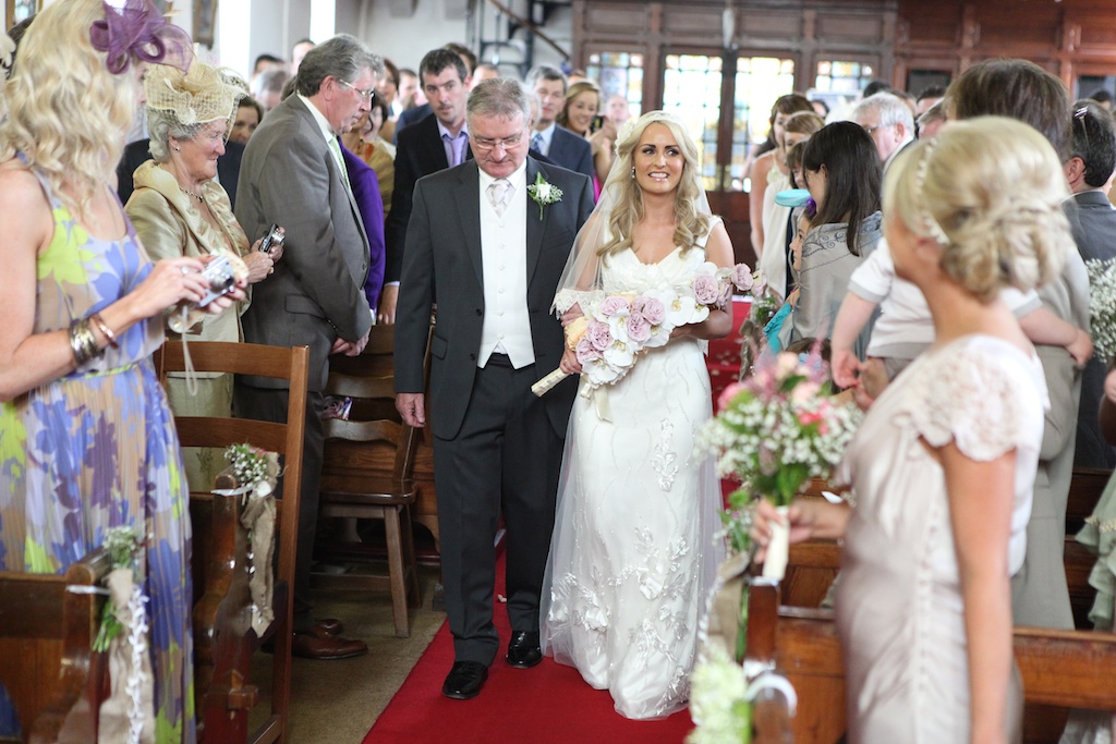 bride and father walking up aisle
